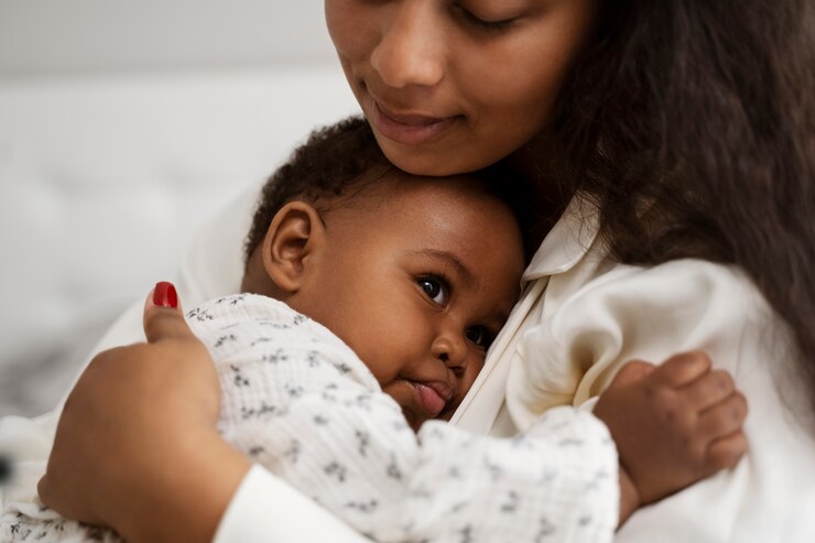 A mother holding her toddler