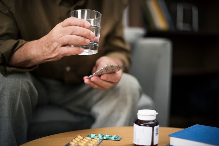 A man taking pills