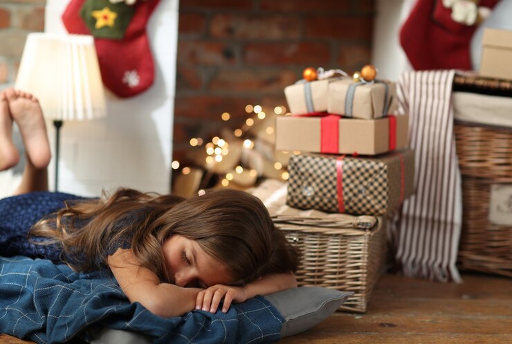 child napping on the floor during the holidays