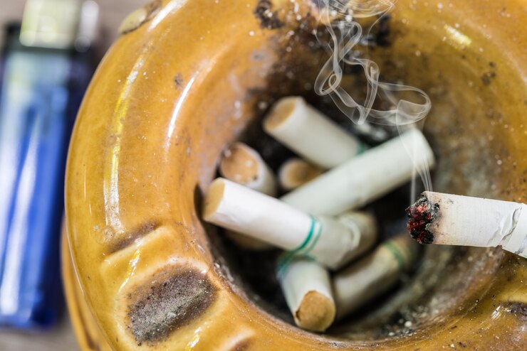 cigarette ashtray with smoke