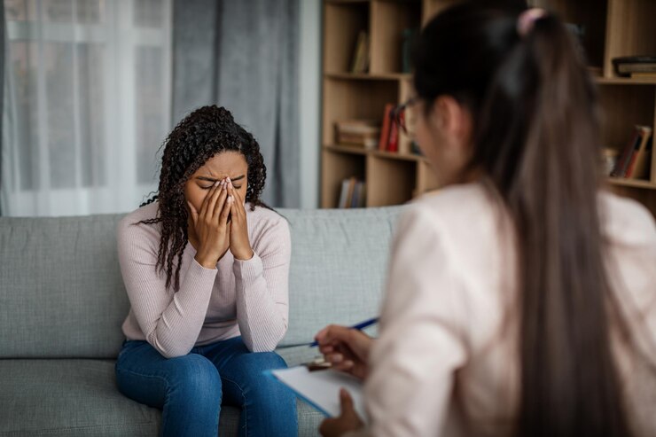 female patient talking to European therapist