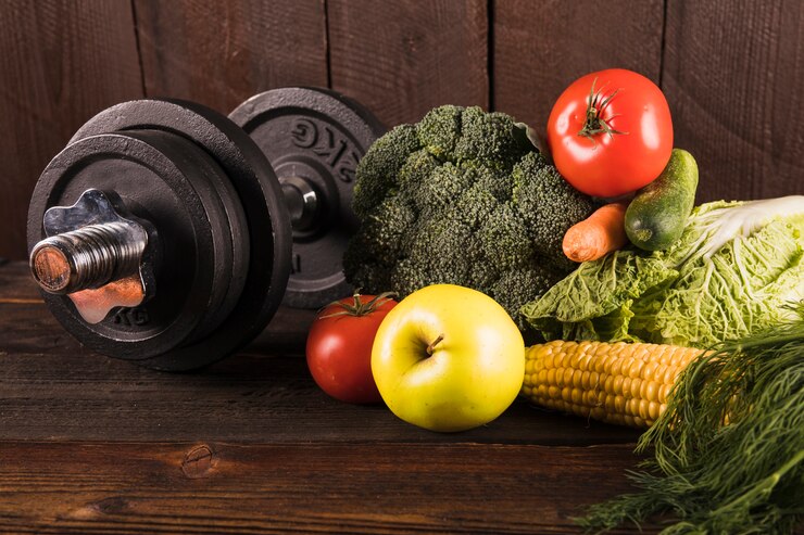 fresh vegetables, and a dumbbell