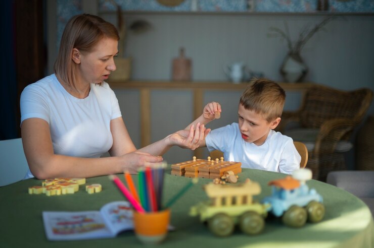 mother plays with her autistic child