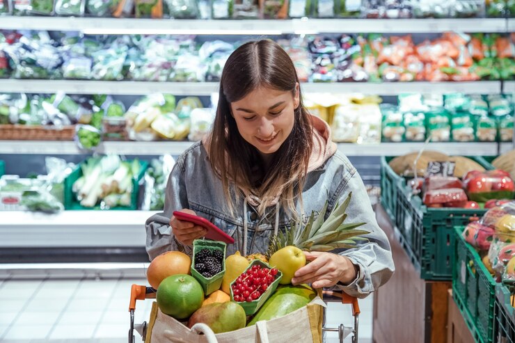 young woman looks up the information of products when shopping for groceries