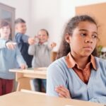 a mixed-race child being bullied by her classmates