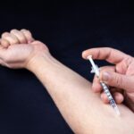 drug addict with syringe