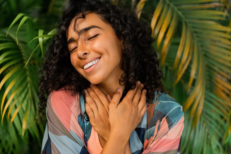 a lovely woman posing in a tropical setting