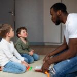 a man talking to his kids